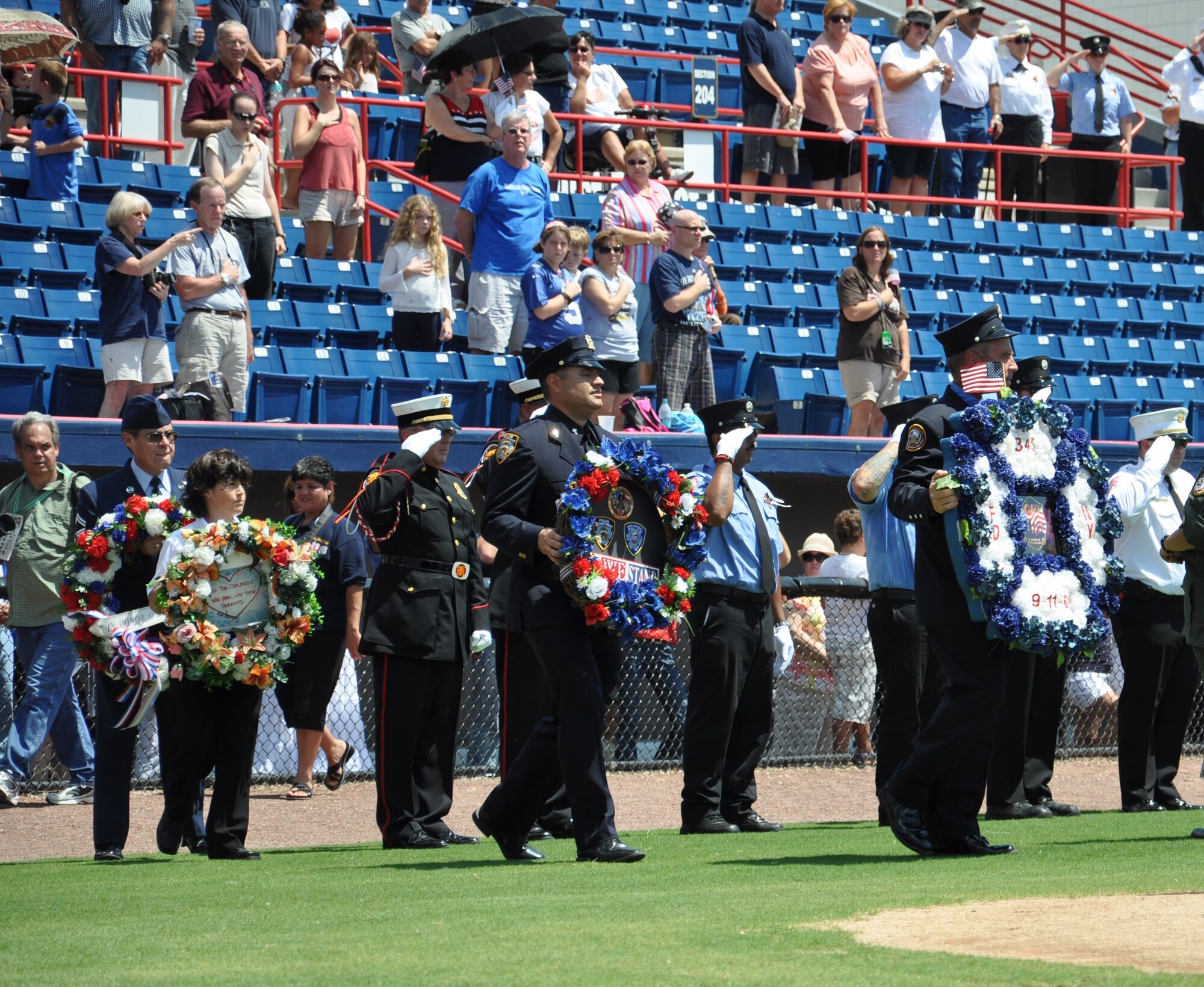 Representatives of the victims of 9/11 lay wreaths at the Brevard Remembers Ceremony in honor of the 10th anniversary of 9/11 at Space Coast Stadium in Viera.