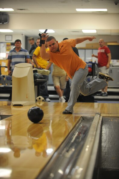 Steven Ellison, member of the 71 Aircraft Maintenance Squadron  bowling team, participates in the Moody Air Force Base, Ga., Thursday night intramural bowling league on Sept. 15, 2011. Ellison and his team will take on 9 other squadrons in a split season, where there will be a break within the 24 week long season. (U.S. Air Force photo by Airman 1st Class Paul Francis/Released)