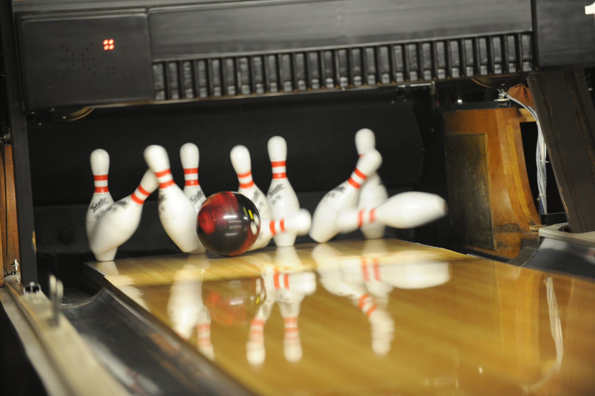 Members of Moody Air Force Base, Ga., have 10 minutes to practice before their three games of the night began on Sept. 15, 2011. The time allows players to get warmed up for the game and get used to the lanes.  (U.S. Air Force photo by Airman 1st Class Paul Francis/Released)
