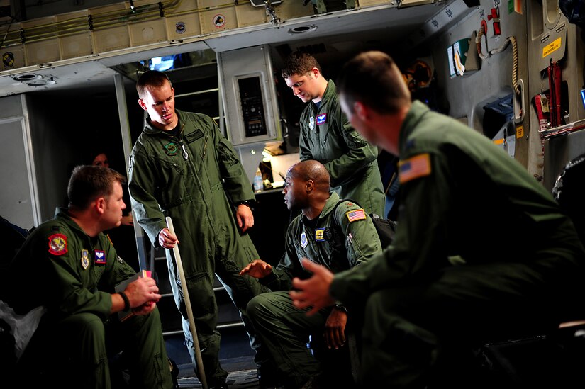 U.S. Air Force pilots and loadmasters discuss airdrop procedures on a C-17 Globemaster III on the Joint Base Charleston, S.C., flightline Sept. 7, 2011.  (U.S. Air Force photo/Staff Sgt. Nicholas Pilch) (RELEASED)