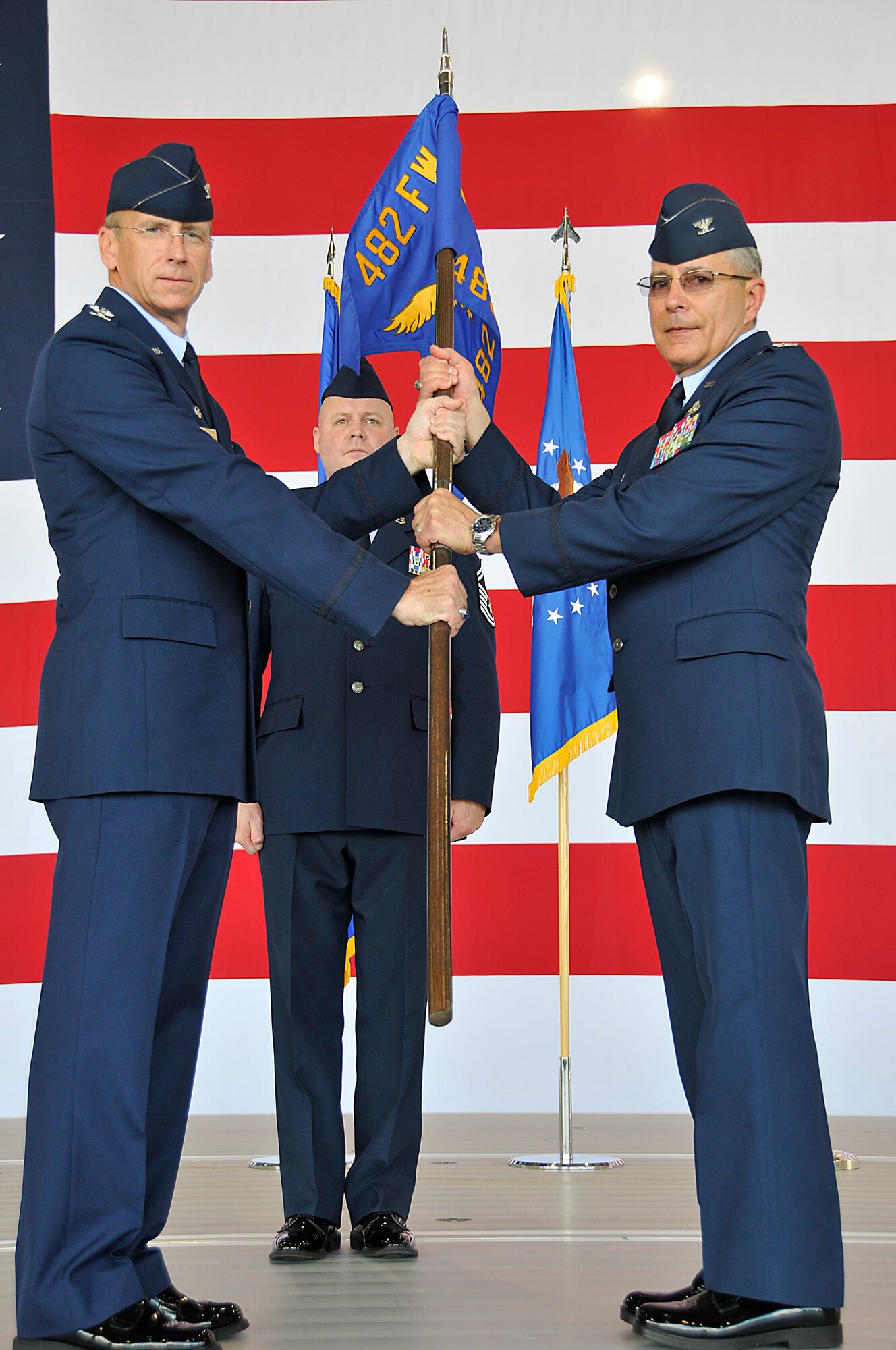 Colonel Gerald F. Micheletti assumed command of the 482nd Fighter Wing Maintenance Group on Sept. 11. Colonel Donald R. Lindberg, Commander, 482nd Fighter Wing passes the guidon.