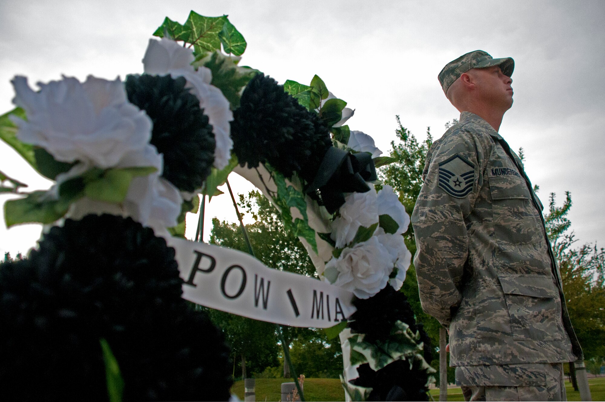 LAUGHLIN AIR FORCE BASE, Texas -- Master Sgt. Frank Munderback, 47th Force Support Squadron, stands vigil over a Prisoners of War/Missing in Action wreath at Heritage Park here Sept. 16. Laughlin Airmen are playing their part on National POW/MIA Recognition Day and remembering the sacrifices made by POW and MIA servicemembers with a vigil throughout the day and a retreat ceremony. (U.S. Air Force photo/Senior Airman Scott Saldukas) 