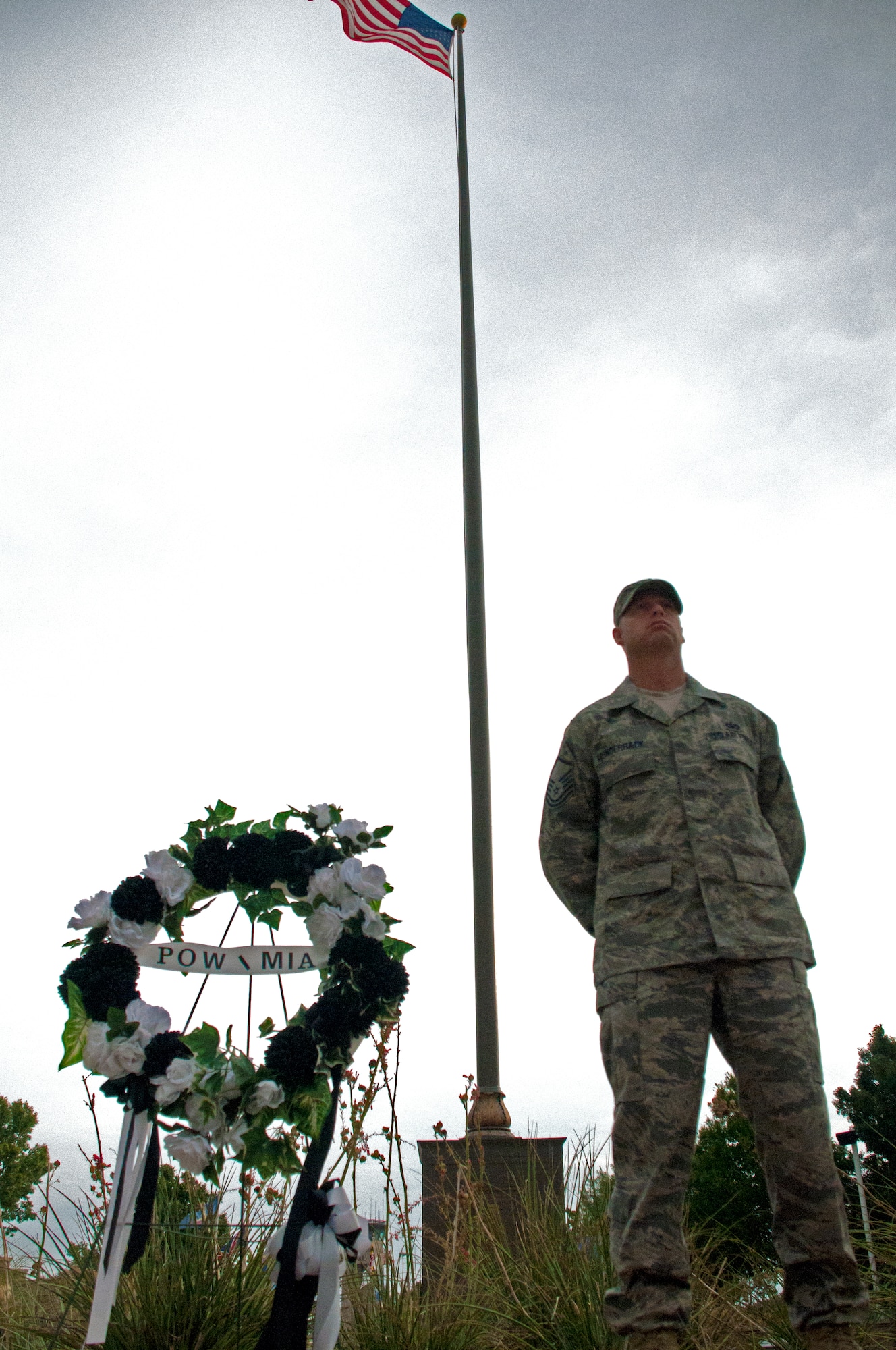 LAUGHLIN AIR FORCE BASE, Texas -- Master Sgt. Frank Munderback, 47th Force Support Squadron, stands vigil over a Prisoners of War/Missing in Action wreath at Heritage Park here Sept. 16. Laughlin Airmen are playing their part on National POW/MIA Recognition Day and remembering the sacrifices made by POW and MIA servicemembers with a vigil throughout the day and a retreat ceremony. (U.S. Air Force photo/Senior Airman Scott Saldukas) 