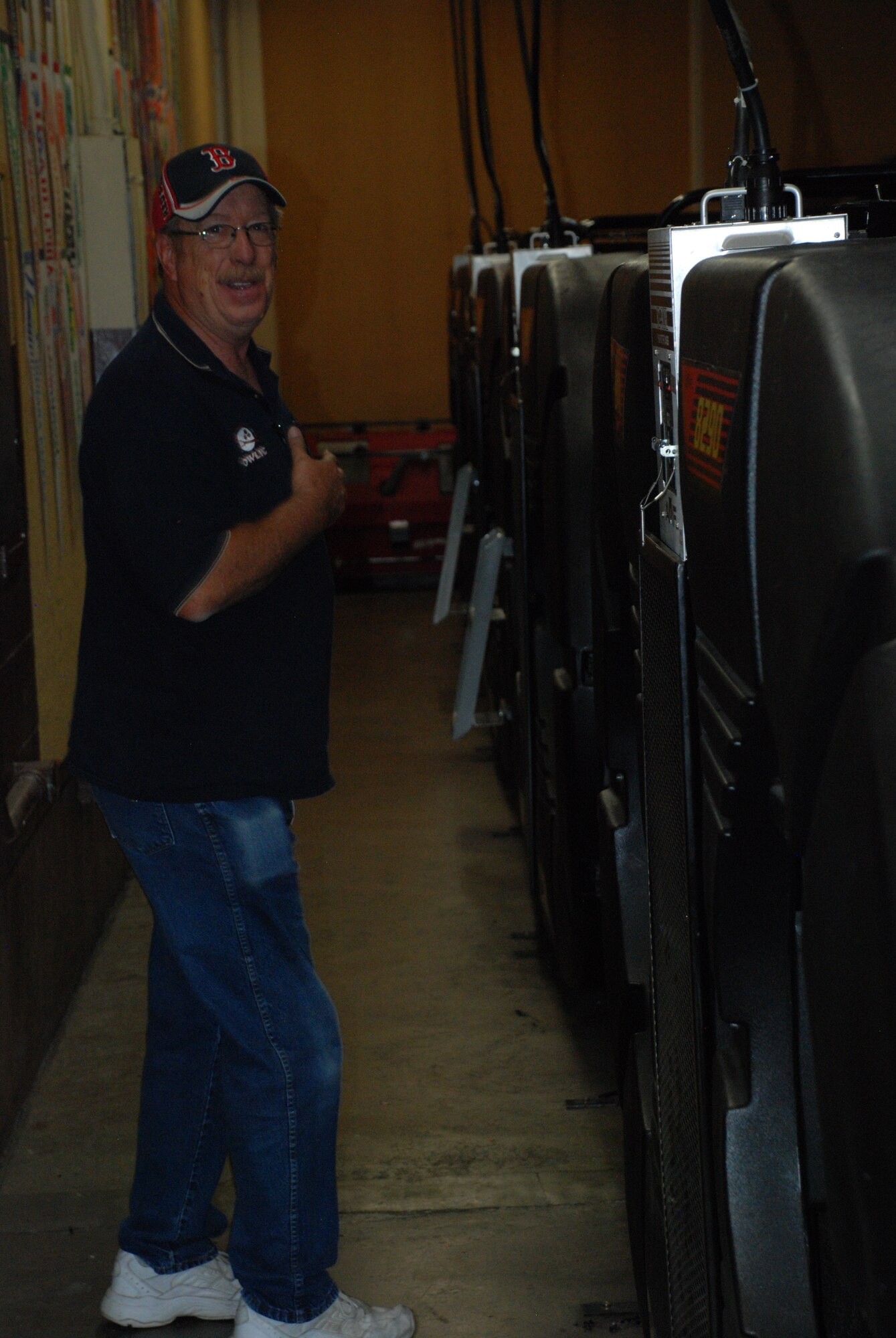 Bernard “Mack” McBreairty, 90th Force Support Squadron bowling center lead mechanic, walks alongside the pinsetter machines behind the lanes in Warren’s bowling center Sept. 12. While behind the lanes, Mack is in charge of ensuring customers have minimal to no delay in their bowling experience. (U.S. Air Force photo by Staff Sgt. Mike Tryon)