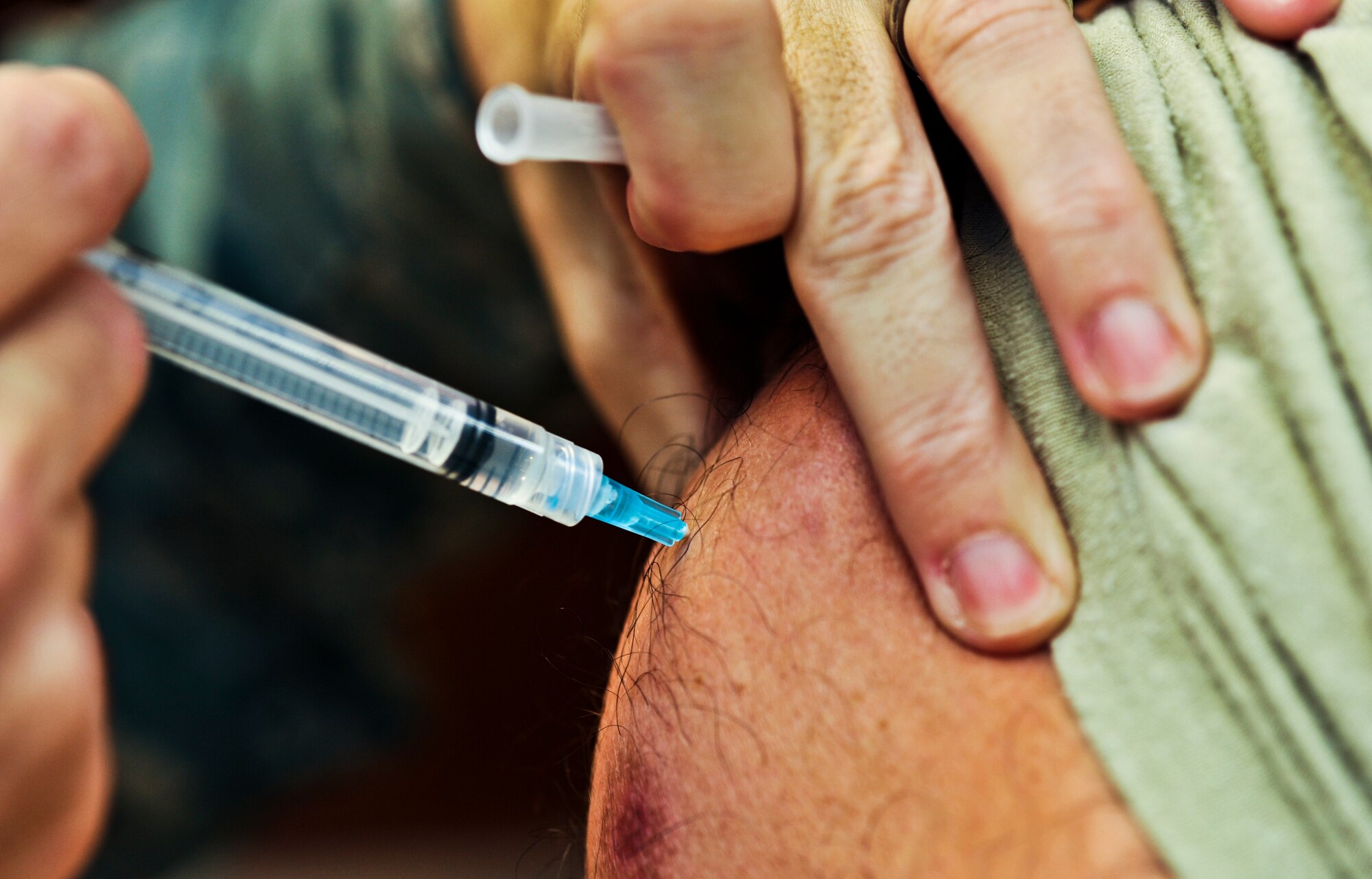 SOUTHWEST ASIA -- A U.S. servicemember receives a flu vaccine, Sept. 13, 2011, at an undisclosed location in Southwest Asia. Flu vaccines are available for all active duty, Guard, Reserve and coalition forces. (U.S. Air Force photo/Senior Airman Paul Labbe)