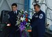 Chief Master Sgt. Emil Garza, 433rd AIrlift Wing command chief, and Chief Master Sgt. Gil Morales, 433rd Aircraft Maintenance Squadron first sergeant, brought forward a floral arrangement during the ceremony commemorating the 10th anniversary of September 11th. The ceremony included a bell sounding for each year since the attacks and the playing of Taps. (U.S. Air Force photo/Senior Airman Viola Hernandez)