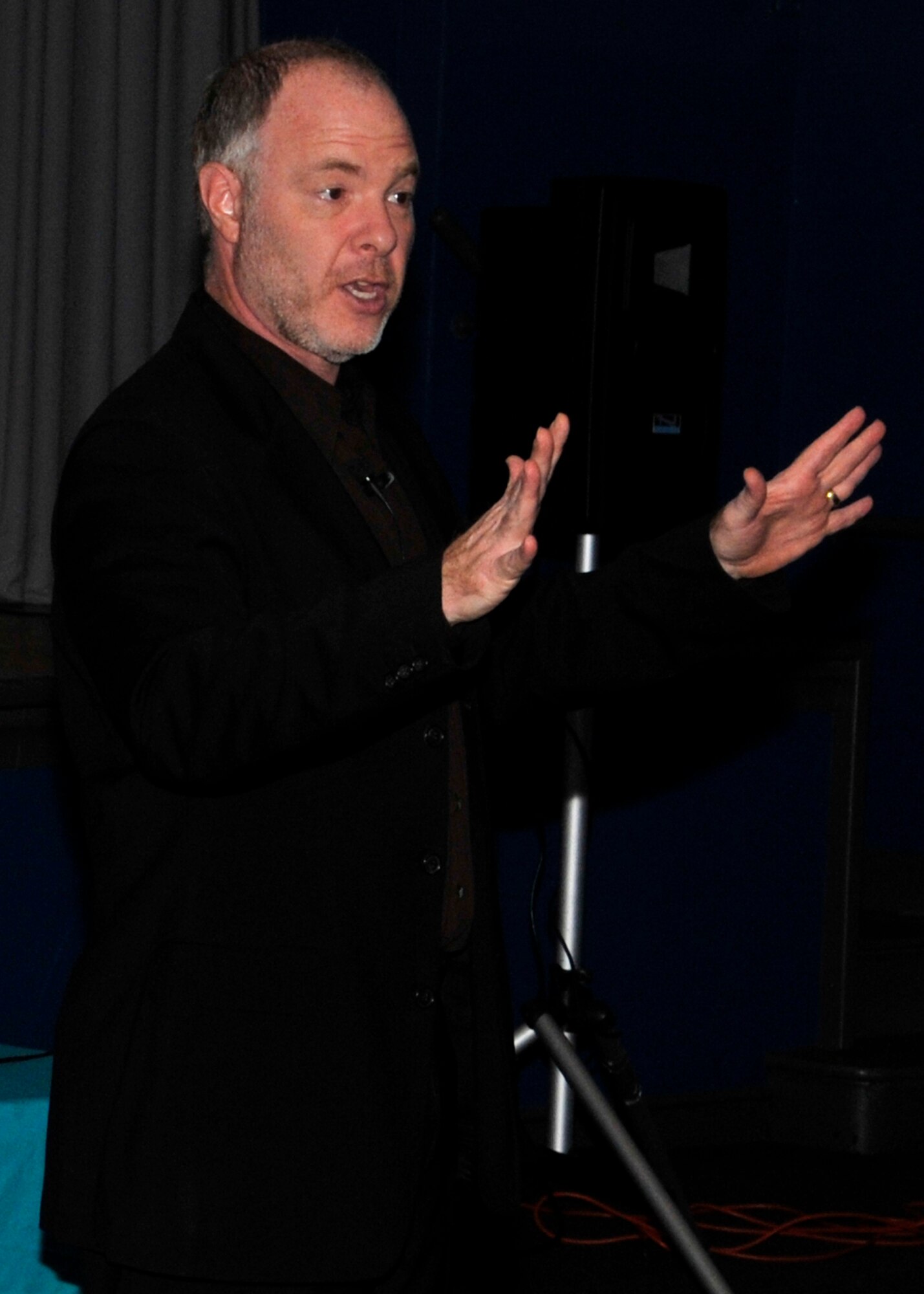 ROYAL AIR FORCE LAKENHEATH, England - Dr. Jackson Katz, subject matter expert for bystander intervention training, educates Airmen on sexual assault and the media?s impact on our viewpoints at the base theater, Sept. 16, 2011. Dr. Katz uses video clips to show how photographs, advertisements and music videos can shape people?s minds into believing that men must be violent, women are weak among other things. (U.S. Air Force photo by Senior Airman Tiffany M. Deuel)