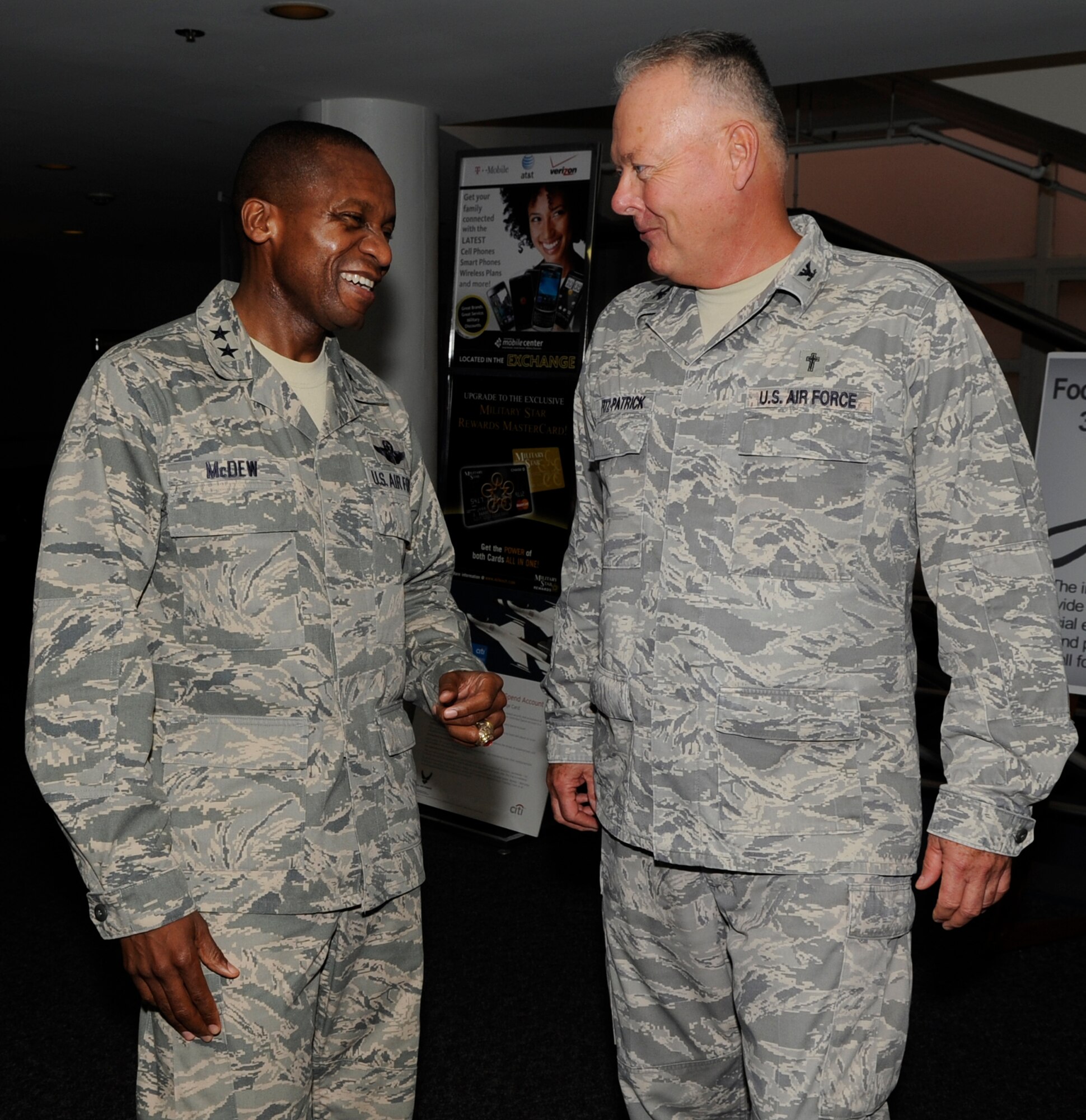 Maj. Gen. Darren W. McDew, commander of Air Force District of Washington, greets Col. David Fitz-Patrick, AFDW Chaplin, at the cake and ice cream social held in celebration of the Air Force Birthday Sept. 15 on Joint Base Andrews, Md. The Air Force celebrates it's 64th birthday on Sept. 18. (U.S. Air Force photo by Staff Sgt. Christopher Ruano)