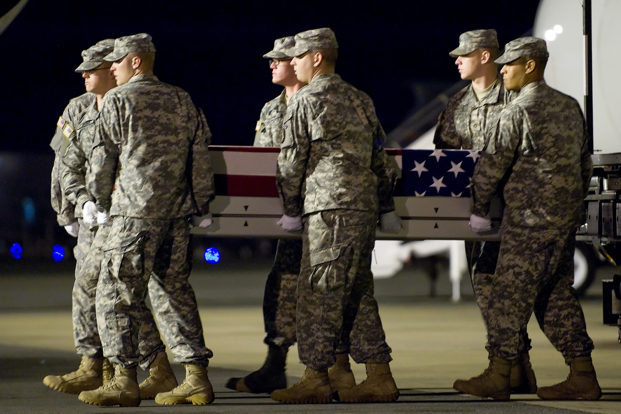 A U.S. Army carry team transfers the remains of Army Sgt. Rodolfo Rodriguez Jr., of Denton, Texas., at Dover Air Force Base, Del., Sept. 16, 2011.  Rodriguez was assigned to the 3rd Battalion, 21st Infantry Regiment, 1st Stryker Brigade Combat Team, 25th Infantry Division, Fort Wainwright, Alaska. (U.S. Air Force photo/Steve Kotecki)

