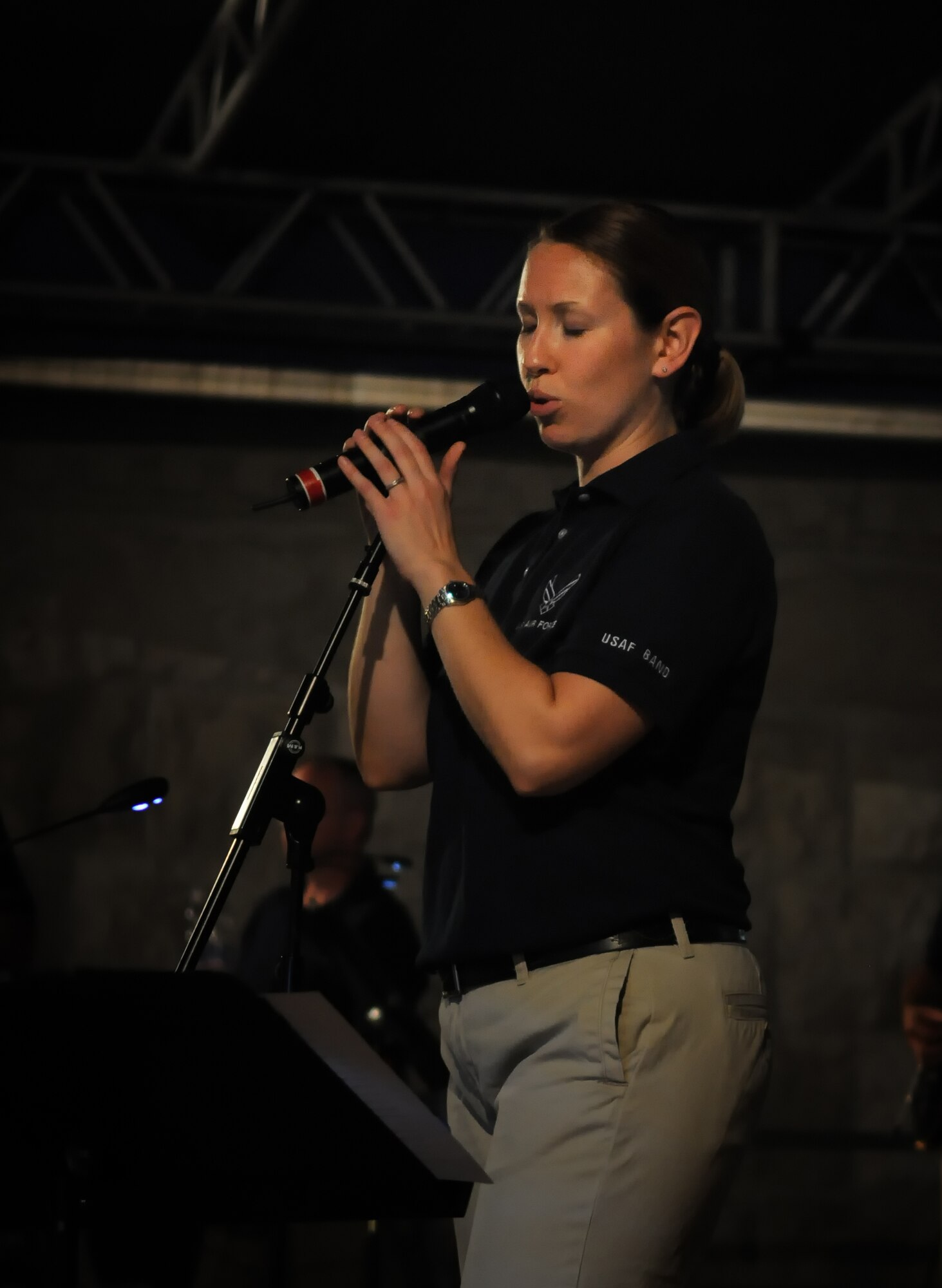 Staff Sgt. Rachel Trimble, lead vocalist for the band "Direct Hit," sings during a performance Sept. 15 in the Aviano town square. Direct Hit is one of the United States Air Forces in Europe Band's popular music ensembles and delivers high energy performances representing the professionalism of the men and women of the United States Air Force.  (U.S. Air Force photo/Staff Sgt. Justin Weaver)