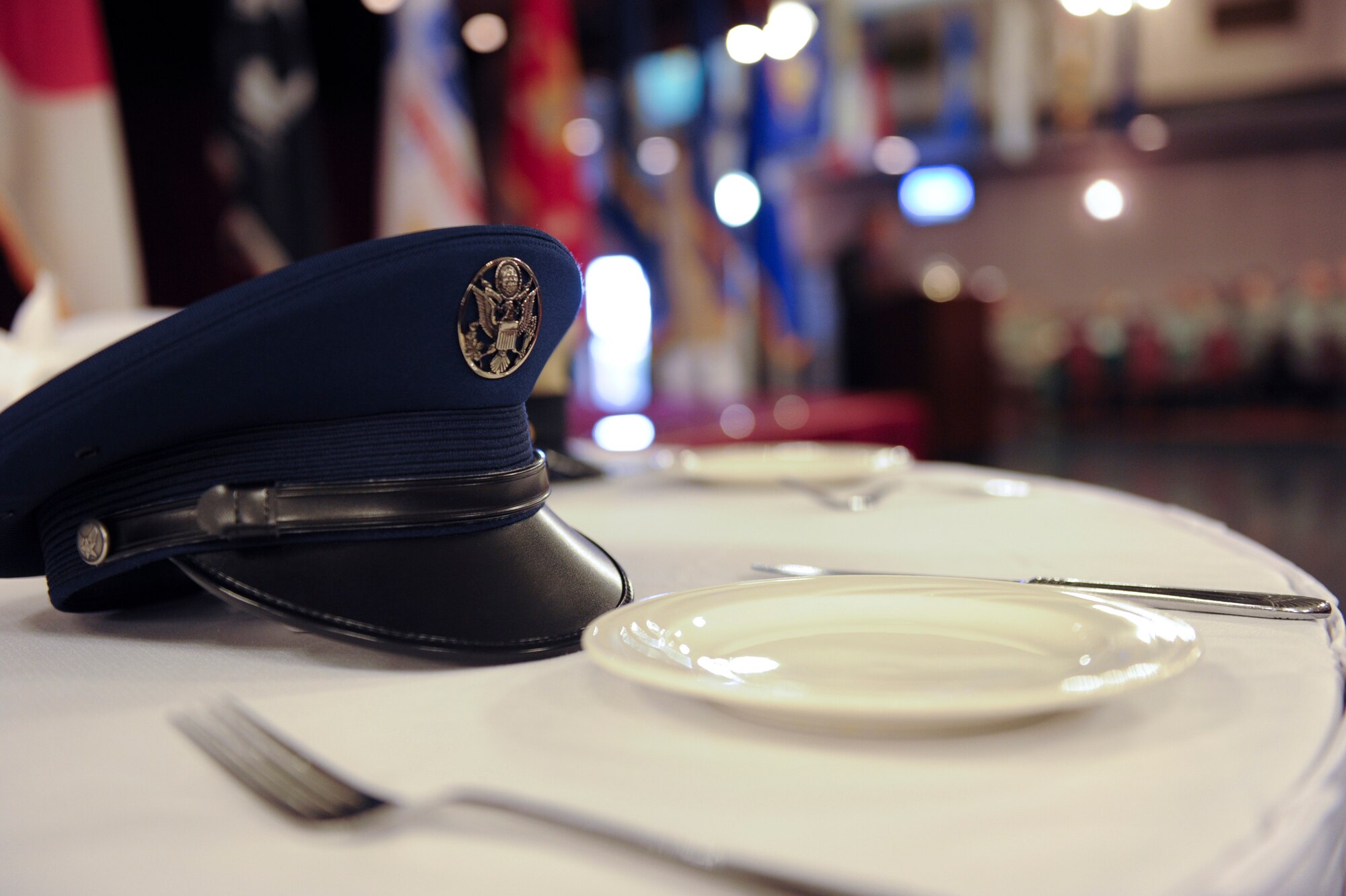 A U.S. Air Force service cap sits at an empty table to represent the Air Force members that are prisoners of war or those missing in action during Kadena's POW/MIA ceremony Sept. 16, 2011. Although the third Friday of every September is the national POW/MIA Remembrance Day, it is important to remember those that have yet to return and their families every day. (U.S. Air Force photo by Airman 1st Class Brooke P. Beers/released)