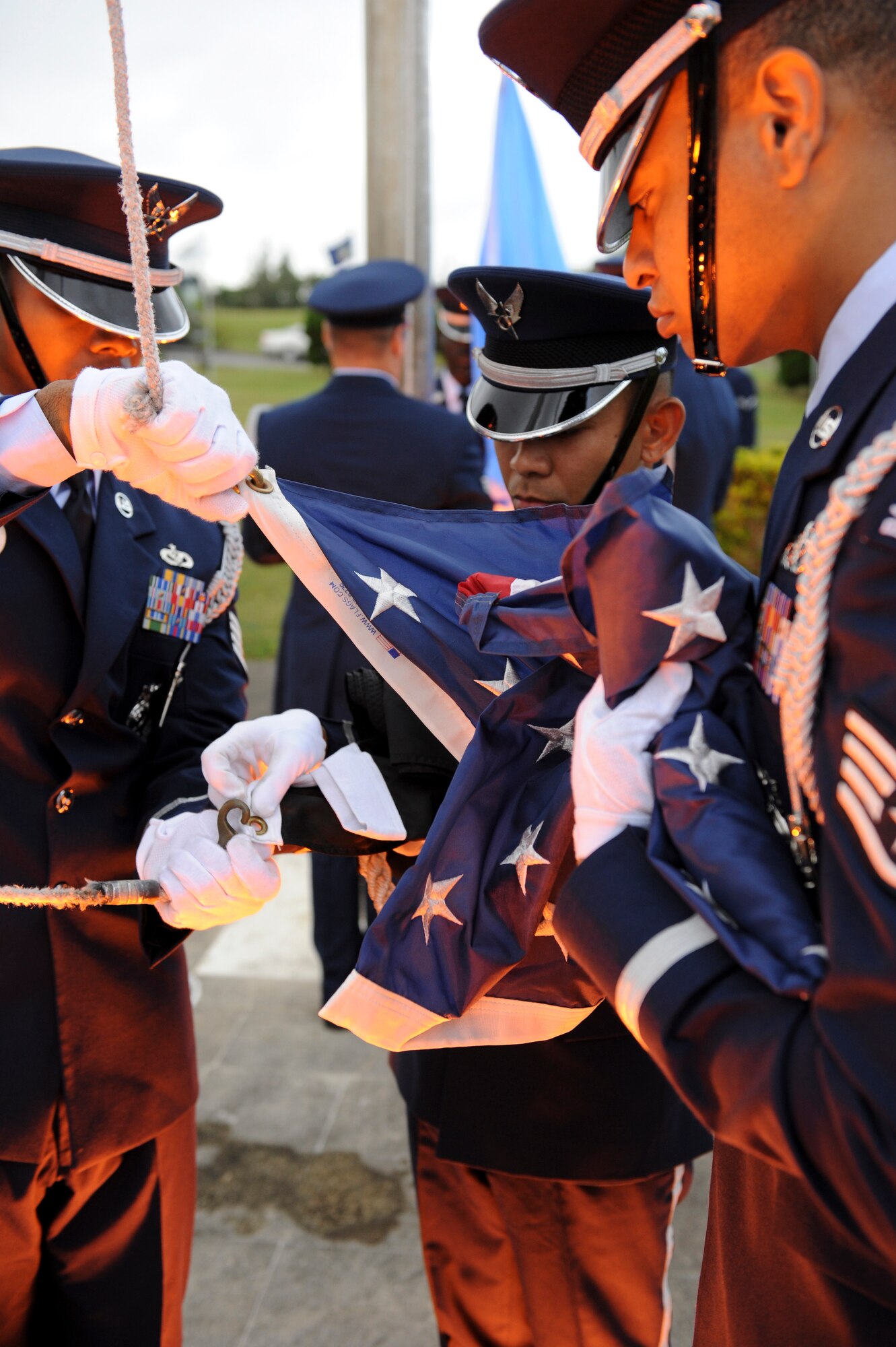 Members of the Kadena Air Base Honor Guard add the Prisoner of War and Missing in Action flag during Kadena's POW/MIA ceremony Sept. 16, 2011. The national POW/MIA recognition day is observed on the third Friday of September every year, but it is important to always remember the sacrifice of prisoners of war and those missing in action.  (U.S. Air Force photo by Airman 1st Class Brooke P. Beers)     