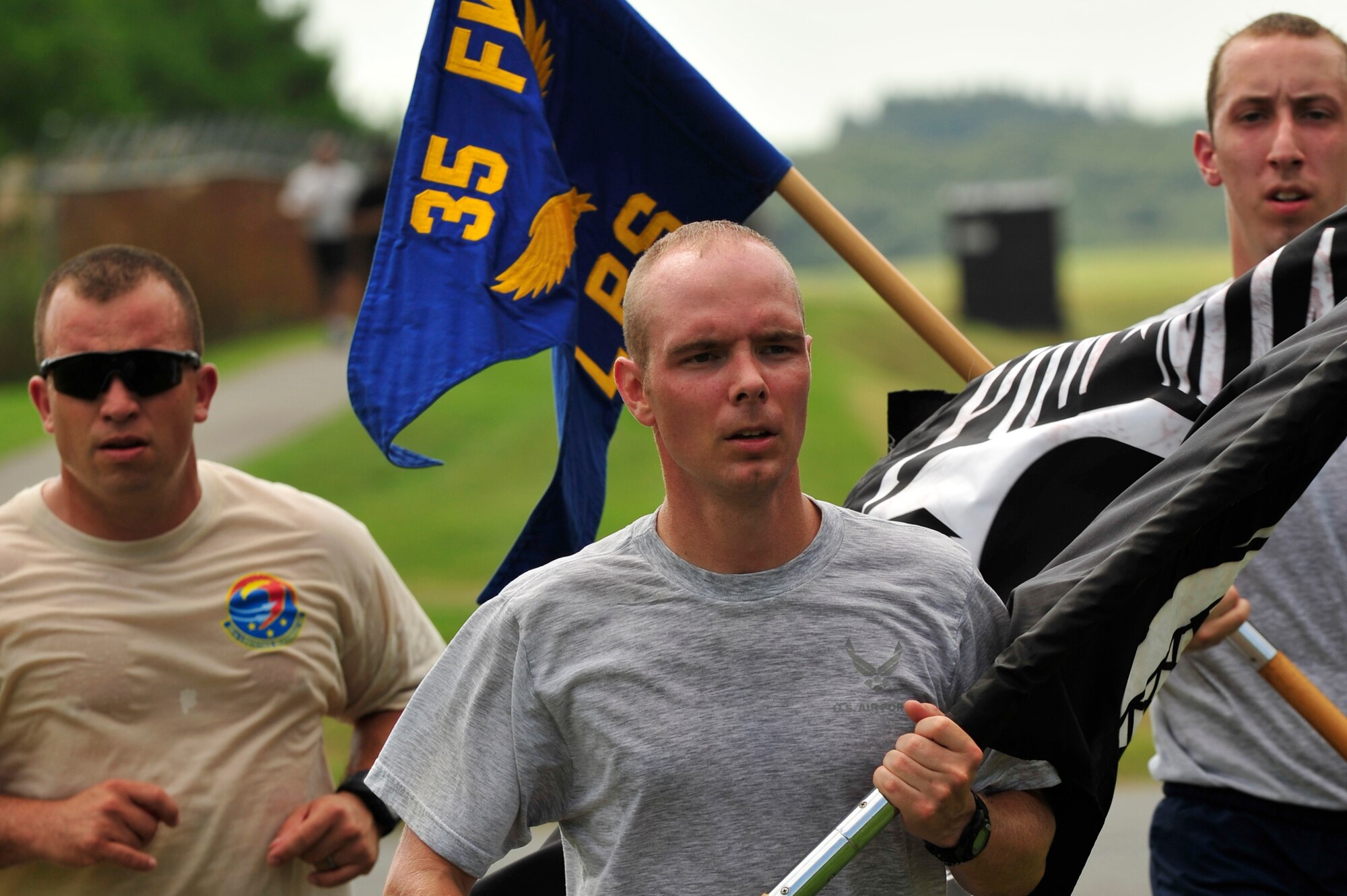 MISAWA AIR BASE, Japan - Members of the 35th Logistics Readiness Squadron honor the sacrifice of all Prisoners of War and those Missing in Action during the 35 LRS POW/MIA Recognition Day run, Sept. 16.  Members of the squadron ran the perimeter of the base for 24 hours in remembrance of prior service members who have gone missing in combat and endured enemy prison camps as part of their sacrifice. (U.S. Air Force photo/Staff Sgt. Nathan Lipscomb)