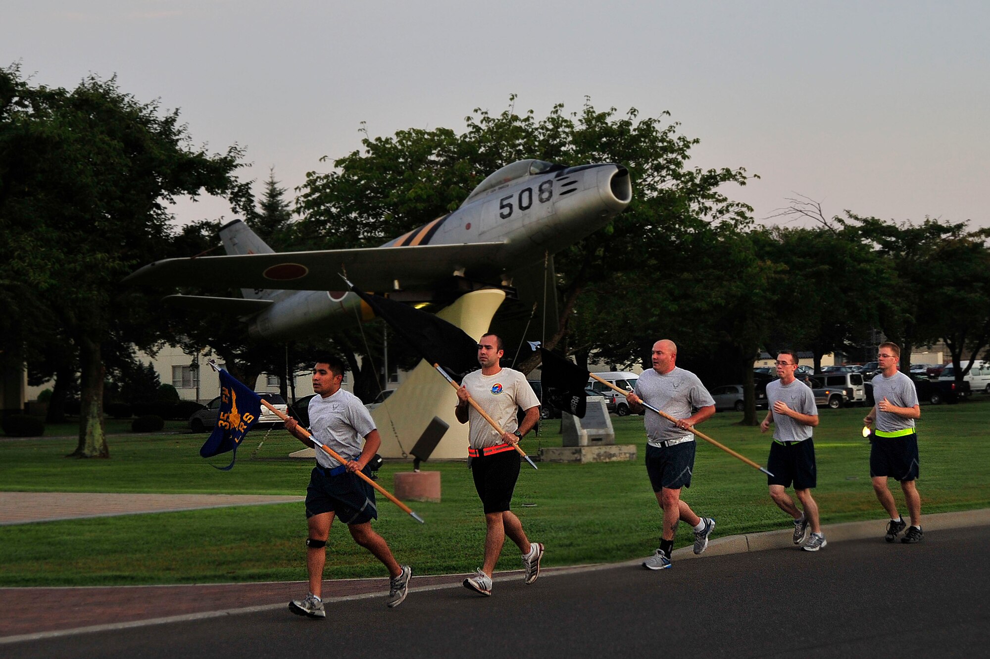 MISAWA AIR BASE, Japan - Members of the 35th Logistics Readiness Squadron honor the sacrifice of all Prisoners of War and those Missing in Action during the 35 LRS POW/MIA Recognition Day run, Sept. 16.  Members of the squadron ran the perimeter of the base for 24 hours in remembrance of prior service members who have gone missing in combat and endured enemy prison camps as part of their sacrifice. (U.S. Air Force photo/Staff Sgt. Nathan Lipscomb)