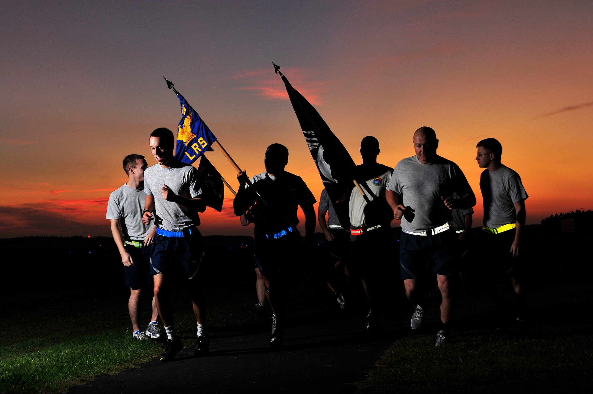 MISAWA AIR BASE, Japan - Members of the 35th Logistics Readiness Squadron start their leg of the 35 LRS POW/MIA Recognition Day run just as the sun begins to rise, Sept. 16.  Members of the squadron ran the perimeter of the base for 24 hours in remembrance of prior service members who have gone missing in combat and endured enemy prison camps as part of their sacrifice. (U.S. Air Force photo/Staff Sgt. Nathan Lipscomb)