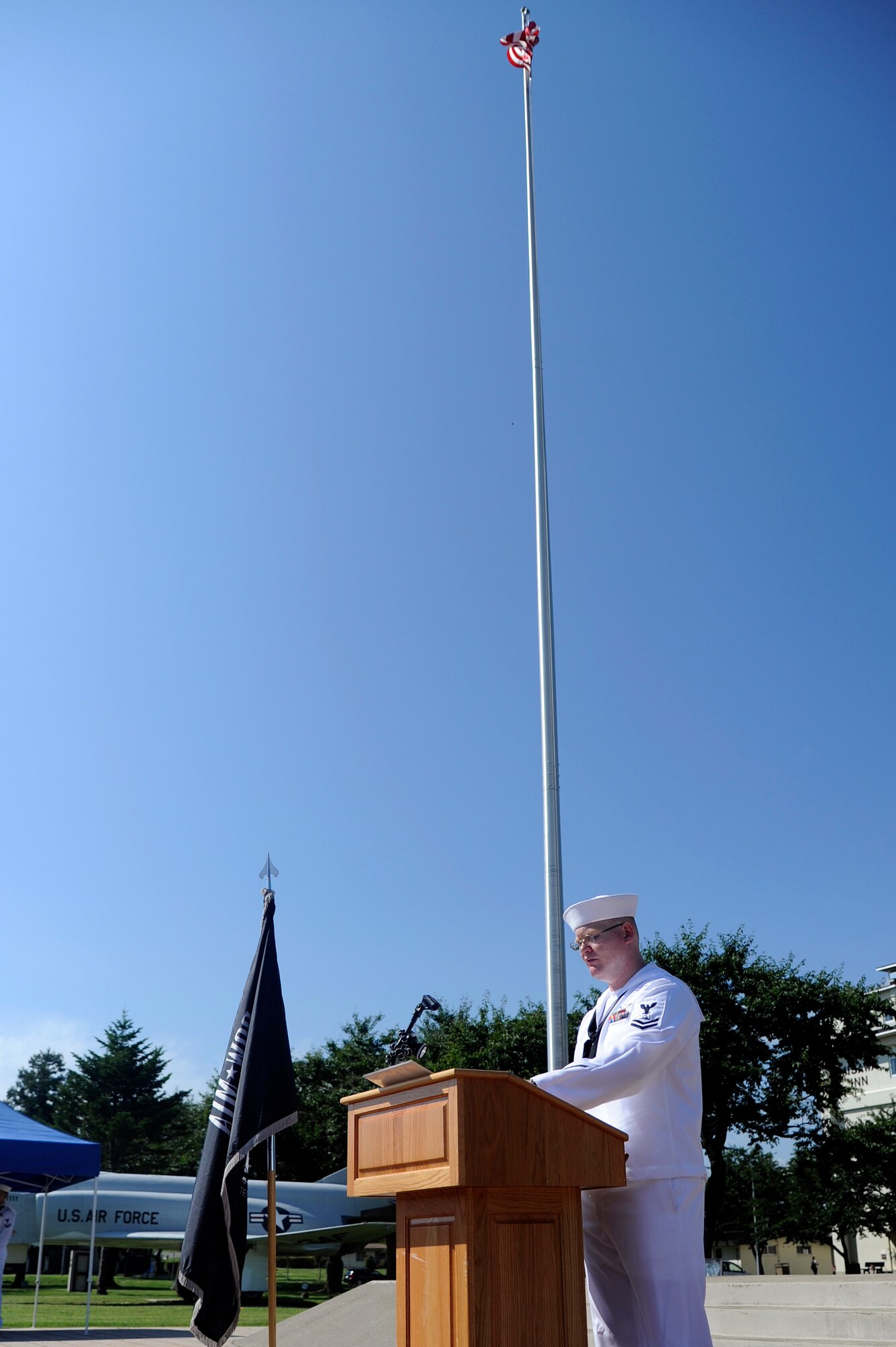 MISAWA AIR BASE, Japan - U.S. Navy Petty Officer 2nd Class Fred Hampton, Naval Air Facility, announces names during Misawa's POW/MIA Recognition Day vigilance ceremony here Sept. 16. More than 90 Airmen and Sailors stood for 15 minutes at a time announcing names of fallen heroes from the Vietnam and Korean wars during the 24-hour vigilance. This is the second year Misawa Air Base has held this vigilance. (U.S. Air Force photo/Tech. Sgt. Marie Brown)