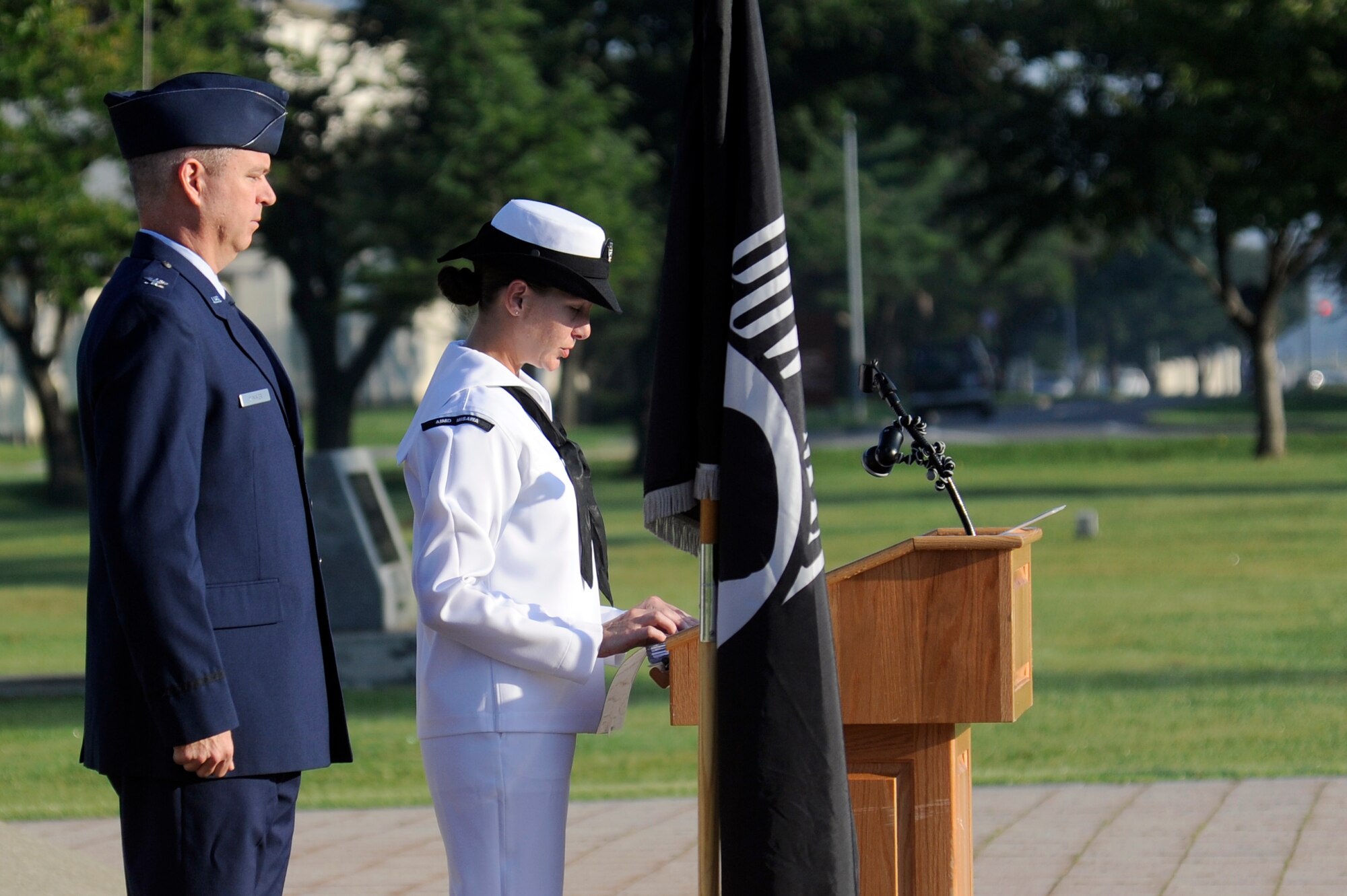 MISAWA AIR BASE, Japan - U.S. Air Force Col. Al Wimmer, left, 35th Fighter Wing vice commander, prepares to relieve U.S. Navy Petty Officer 2nd Class Iasrealia Berns, Aircraft Intermediate Maintenance Department, during Misawa'a POW/MIA Recognition Day vigilance ceremony here Sept. 16. More than 90 Airmen and Sailors stood for 15 minutes at a time announcing names of fallen heroes from the Vietnam and Korean wars during the 24-hour vigilance. This is the second year Misawa Air Base has held this vigilance. (U.S. Air Force photo/Tech. Sgt. Marie Brown)