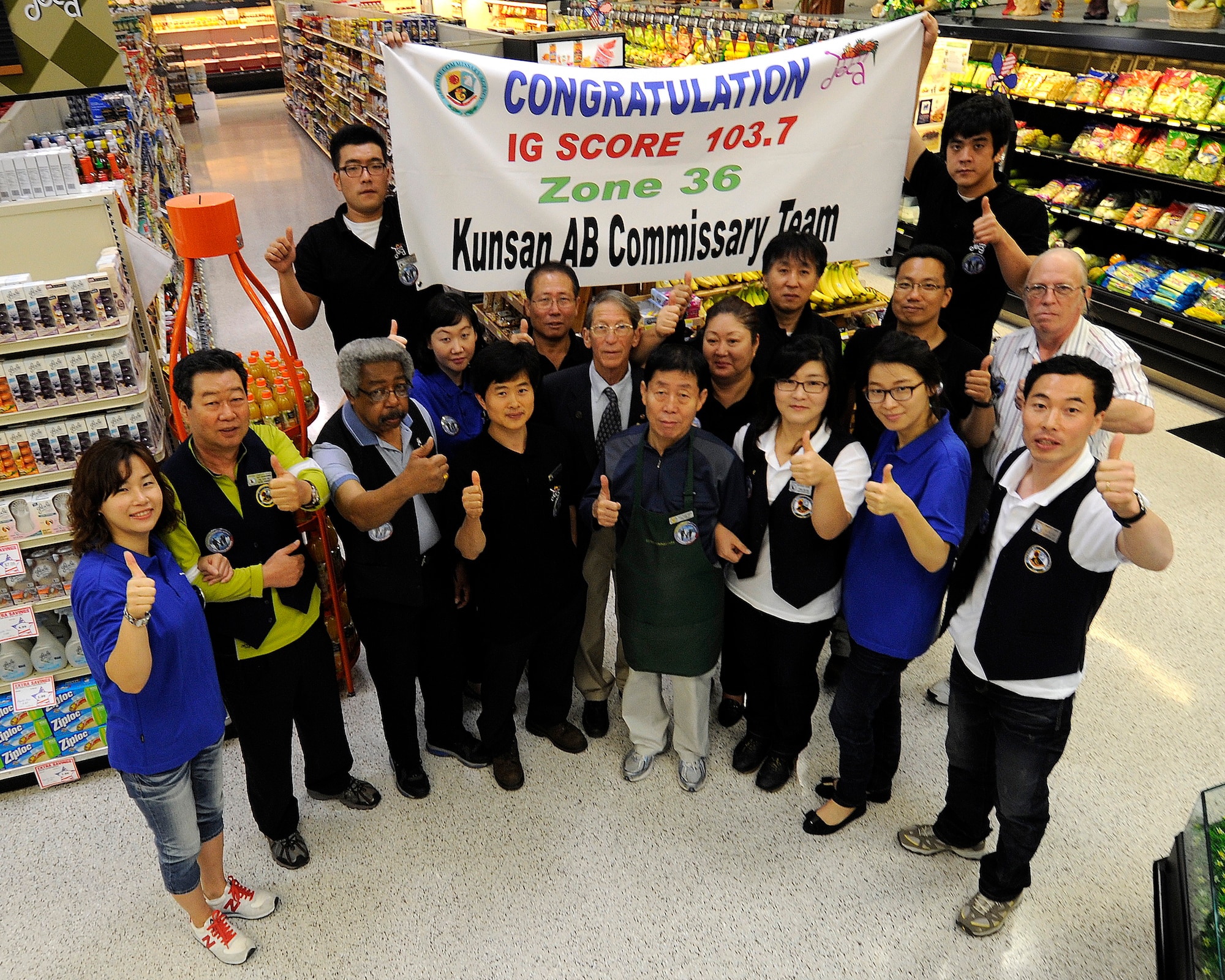 KUNSAN AIR BASE, Republic of Korea -- The Kunsan Commissary team poses for their photo here Sept. 10. Scoring best on the peninsula proves Kunsan’s commissary is the best of the best after receiving a 103.7 compliance rating from the Defense Commissary Agency’s Inspector General here recently. (U.S. Air Force photo/Staff Sgt. Rasheen Douglas)