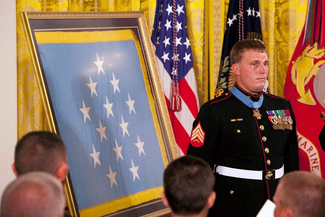 Marine Corps Sgt. Dakota Meyer stands at attention after receiving the Medal of Honor from President Barack Obama during the Medal of Honor presentation ceremony in the East Room of the White House, Washington, D.C., Sept. 15, 2011. 