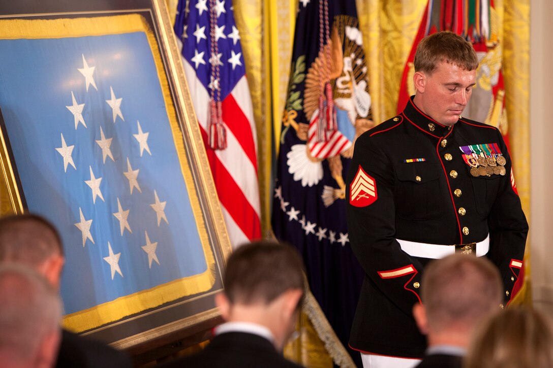 Marine Corps Sgt. Dakota Meyer bows his head in prayer before a the Medal of Honor ceremony in the East Room of the White House, Washington, D.C., Sept. 15, 2011. Meyer is the first living Marine to receive the Medal of Honor for actions in Iraq or Afghanistan. 