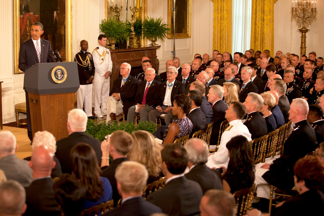 President Barack Obama reads the citation of the Medal of Honor during the Medal of Honor presentation ceremony for Marine Corps. Sgt. Dakota Meyer in the East Room of the White House, Washington, D.C., Sept. 15, 2011. 