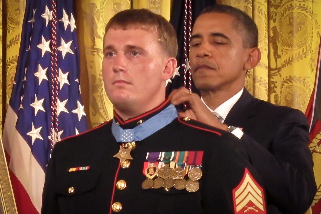 President Barack Obama prsents the Medal of Honor to Marine Corps Sgt. Dakota Meyer during a ceremony in the East Room of the White House, Washington, D.C., Sept. 15, 2011.