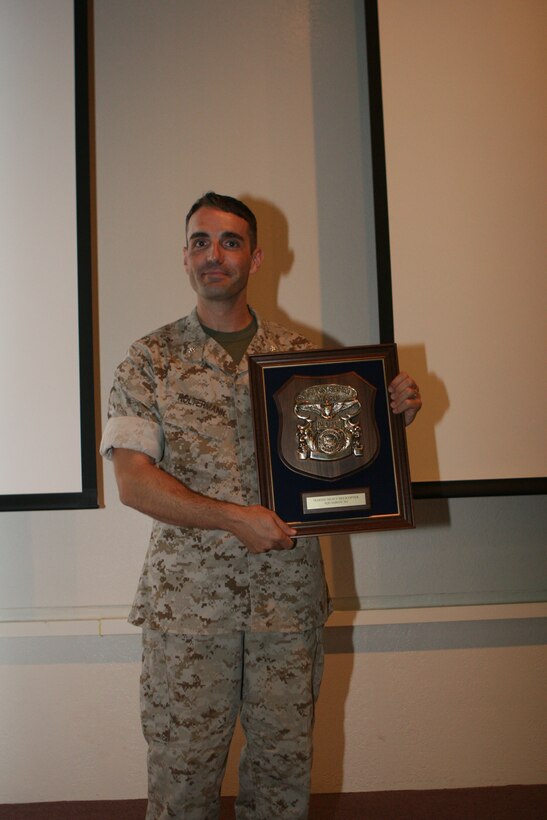 Lt. Col. Jay Holtermann, commanding officer of Marine Heavy Helicopter Squadron 361 and a Greenbay, Wis., native, accepts the Chief of Naval Operations Aviation Safety Award aboard Marine Corps Air Station Miramar Sept. 16. HMH-361 received the award for significant accomplishments during their six months of combat operations while deployed to Helmand province, Afghanistan.