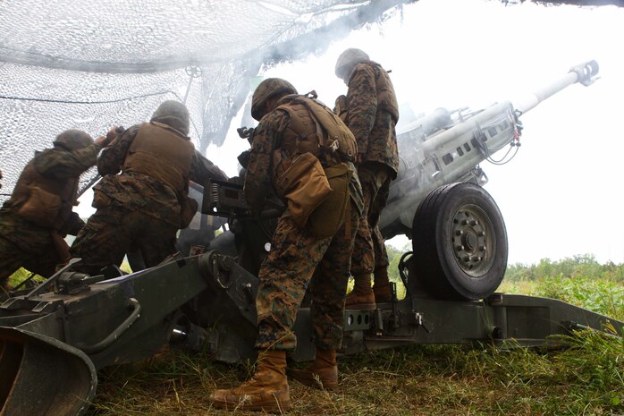 Marine artillery cannon crewmen attached to 1st Battalion, 2nd Marine Regiment fire an M-777 Howitzer on Fort Pickett, Va., Sept. 16, 2011. More than 900 Marines and sailors are taking part in the Deployment for Training exercise at Fort Pickett, Sept. 6-23. The battalion is scheduled to attach to the 24th Marine Expeditionary Unit as its Battalion Landing Team a few days after the training.