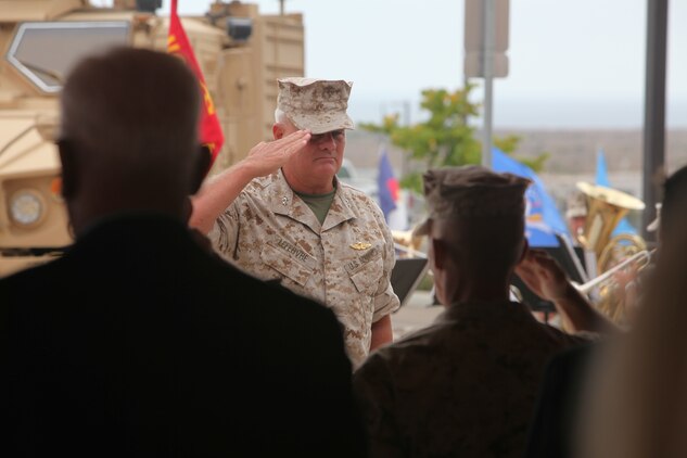 Maj. Gen. Paul E. Lefebvre, commander of U.S. Marine Corps Forces, Special Operations Command, renders a salute during the playing of the National Anthem at a memorial dedication ceremony aboard Camp Pendleton, Calif. Sept. 16, in which a monument dedicated to 1st Marine Special Operations Battalion's fallen warriors was unveiled. September was a month of rememberance and reflection, marked by several ceremonies taking place throughout MARSOC to honor its fallen servicemembers and the victims of 9/11.