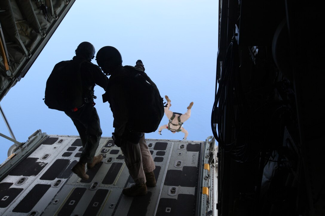 Marines from Special Operations Training Group, III Marine Expeditionary Force, jump out of a C-130 on Sept. 17, during a training jump in Guam. The Marines of SOTG coordinated and supervised the execution of the helicopter assault in Hagatna, Guam, as part of the 31st Marine Expeditionary Unit's Realistic Urban Training Exercise, Sept. 16.