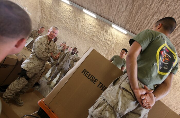 Maj. Gen. John A. Toolan (second from left), commanding general of Regional Command Southwest, speaks with Marines from the 2nd Marine Logistics Group (Forward) postal detachment at the Camp Leatherneck Post Office, Sept. 17. Toolan spent the afternoon touring several of the MLG's facilities including the Intermediate Maintenance Activity lot and the Concussion Restoration Care Center. (U.S. Marine Corps photo by Sgt. Justin J. Shemanski)