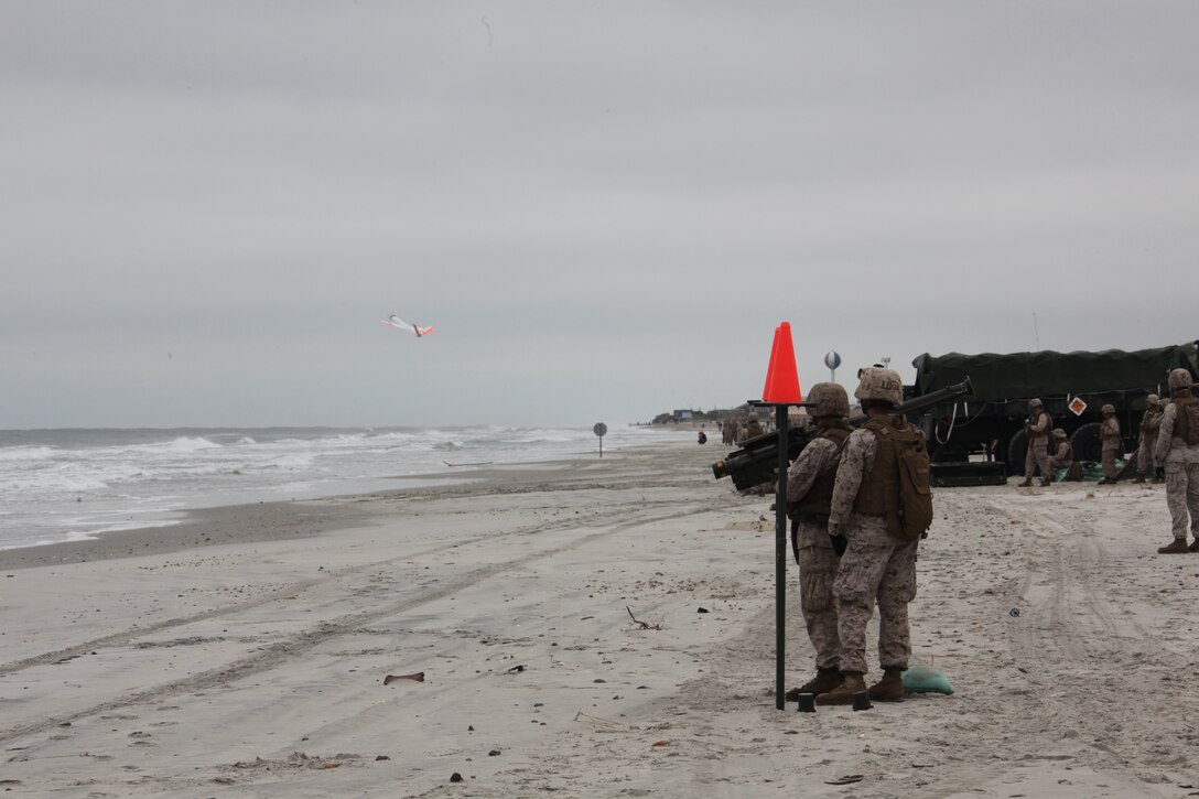 Marines with 2nd Low Altitude Air Defense Battalion watches as an unmanned aerial target launches into its flight pattern on Onslow Beach aboard Marine Corps Base Camp Lejeune, N.C., during 2nd LAAD's live Stinger Missile shoot Sept. 17. The Marines had to conduct several different kinds of training scenarios during the training. They fired at the UATs from static positions; they also conducted quick reaction fires and launched the missile while wearing gas masks.