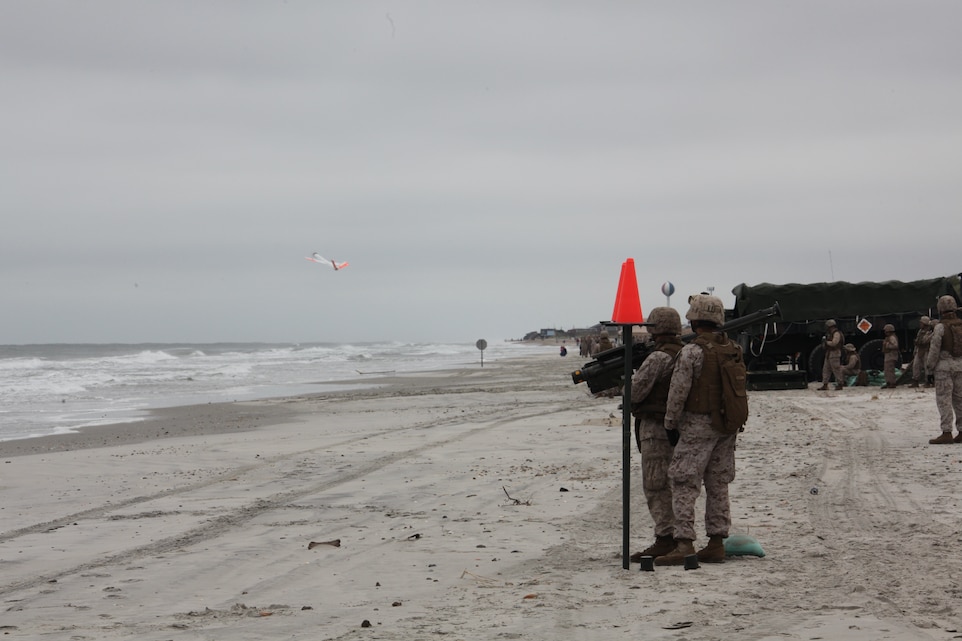 Marines with 2nd Low Altitude Air Defense Battalion watches as an unmanned aerial target launches into its flight pattern on Onslow Beach aboard Marine Corps Base Camp Lejeune, N.C., during 2nd LAAD's live Stinger Missile shoot Sept. 17. The Marines had to conduct several different kinds of training scenarios during the training. They fired at the UATs from static positions; they also conducted quick reaction fires and launched the missile while wearing gas masks.