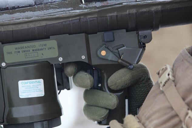 A Marine keeps his finger near the trigger as he sets his target during a PL-87 Stinger missile shoot at Onslow Beach aboard Marine Corps Base Camp Lejeune, N.C., Sept. 17.