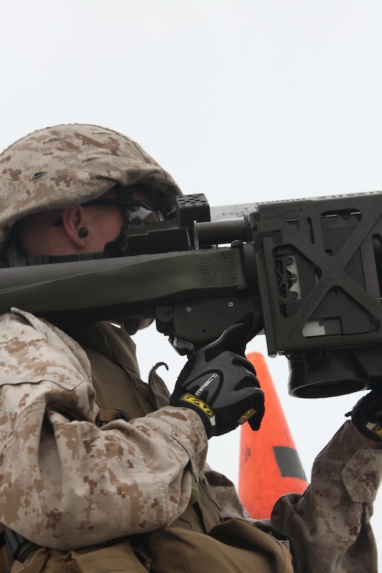 A Marine with 2nd Low Altitude Air Defense Battalion locks on to an unmanned aerial target with his PL-87 Stinger Missile on Onslow Beach aboard Marine Corps Base Camp Lejeune, N.C., during 2nd LAAD's live Stinger Missile shoot Sept. 17. “The air defense battalion is a provisional infantry battalion in the sense when we aren’t firing our missile system at enemy aircraft we are providing security forces for ground troops in theater,” said Lt. Col. Joel A. Burdette, commanding officer of 2nd LAAD Bn. “My Marines here in 2nd LAAD have the knowledge and training to conduct both ground based air defense as well as air based ground defense. We provide the 2nd Marine Aircraft Wing with an air defense umbrella as a key component to Marine Air Control Group 28.”