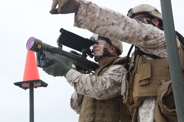 Lt. Col. Joel A. Burdette, commanding officer of 2nd Low Altitude Air Defense Battalion, locks on to an unmanned aerial target with his PL-87 Stinger Missile on Onslow Beach aboard Marine Corps Base Camp Lejeune, N.C., during 2nd LAAD's live Stinger Missile shoot Sept. 17. “We are a critical component in providing air defense against the emerging threats to the 2nd MAW airfields around the globe,” said Burdette. “We, at 2nd LAAD, train for many scenarios and will continue to train to make sure we are ready for any and every threat the Marine Corps and 2nd MAW faces. Whether that is while deployed or at home here at Cherry Point we will continue to be mission ready. We are still riflemen and will continue to support the mission of 2nd MAW.”