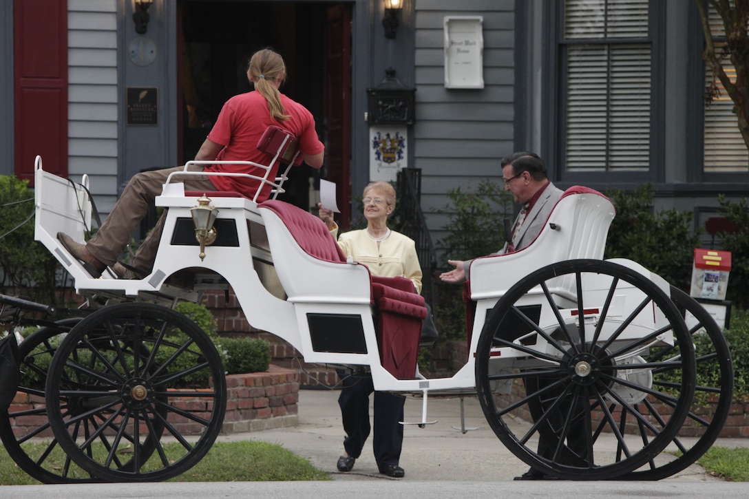 Joe E. Williams, right, escorts his wife of nearly 50 years, Maureen Williams, on a horse carriage ride in New Bern, N.C., Sept. 17, 2011, on its way to drop the couple off for dinner, where they were surprised by their four children. The next the family visited Marine Corps Air Station Cherry Point, where they had not been since they began their marriage more than 40 years ago.