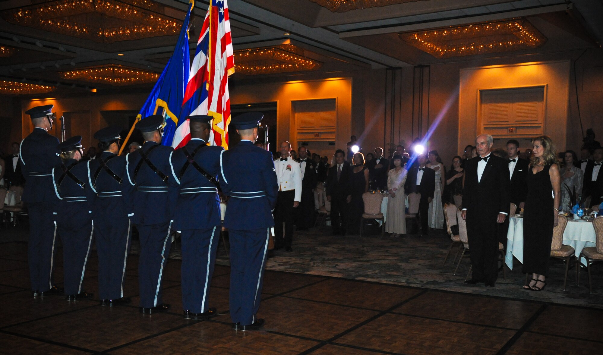 Joint Base Pearl Harbor-Hickam Honor Guard presents the colors at the 64th annual Air Force Ball, held at the Hilton Hawaiian Village in Waikiki, Sept. 16. The theme, 'A tribute to heroes,' paid homage to Airmen throughout the decades. The guest of honor, Senior Airman Brian Kolfage, is a triple amputee from Operation Iraqi Freedom. When introduced, and after a slide show of his story played, Kolfage recieved a standing ovation for his service. (U.S. Air Force photo/Senior Airman Lauren Main)
