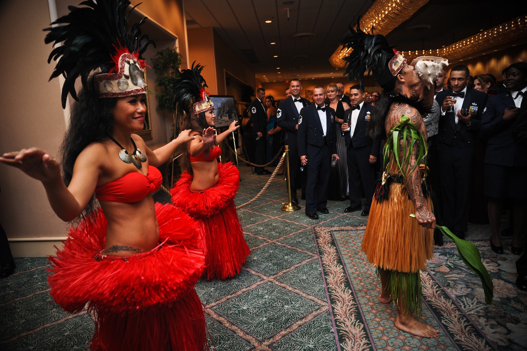 Hawaiian performers welcome guests of the annual 64th Air Force Ball into the ball room at the Hilton Hawaiian Village in Waikiki, Sept. 16. The ball celebrated the Air Force's 64th year as a seperate service and paid tribute to the heroes that have served throughout its history. (U.S. Air Force photo/Senior Airman Lauren Main)
