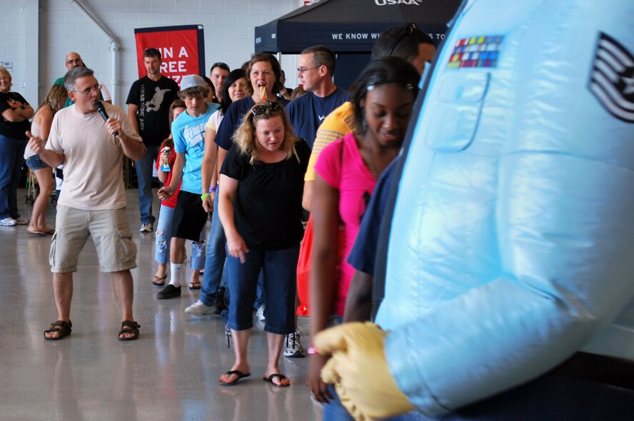 Members of the 507th Air Refueling Wing and their families are lead in "the electric slide" during the festivities at the 2011 507th ARW Family Day. Activities included drawings for prizes, music and inflatable moon walks and face painting for the kids.