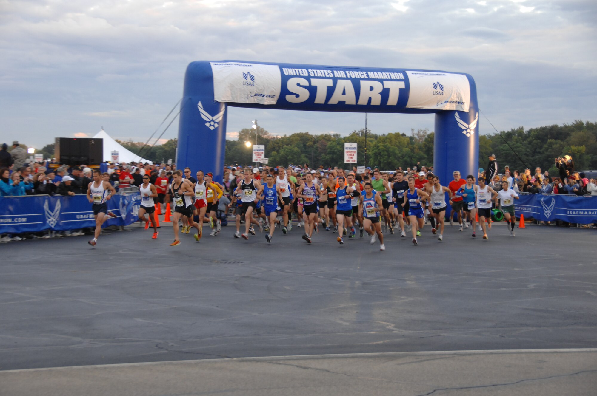 Thousands of runners leave the starting line at the U.S. Air Force Marathon Sept. 17, 2011 at Wright-Patterson Air Force Base, Ohio. A record breaking 13,000 runners registered for the events held on Sept. 16-17. (U.S. Air Force Photo/Ben Strasser)