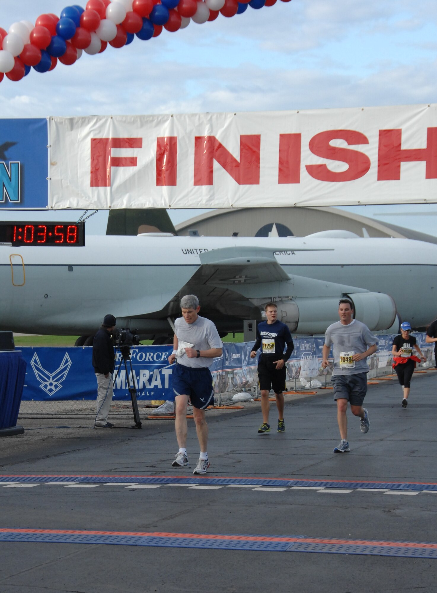 Air Force Chief of Staff Gen. Norton Schwartz crosses the finish line at the Air Force Marathon on Sept. 17, 2011, at Wright-Patterson Air Force Base, Ohio. General Schwartz joined a record setting crowd of 13,000 runners at the 15th annual event. General Schwartz finished the 10k run with a time of just over an hour. (U.S. Air Force photo /Ben Strasser) 
