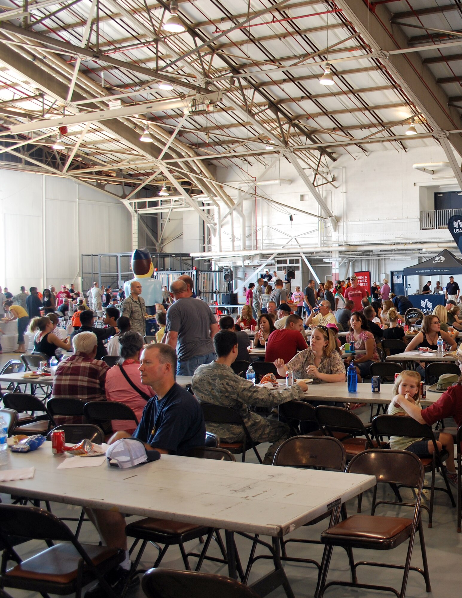 Members of the 507th Air Refueling Wing and their families enjoy the festivities during the 2011 507th ARW Family Day. Activities included drawings for prizes, music and inflatable moon walks and face painting for the kids.