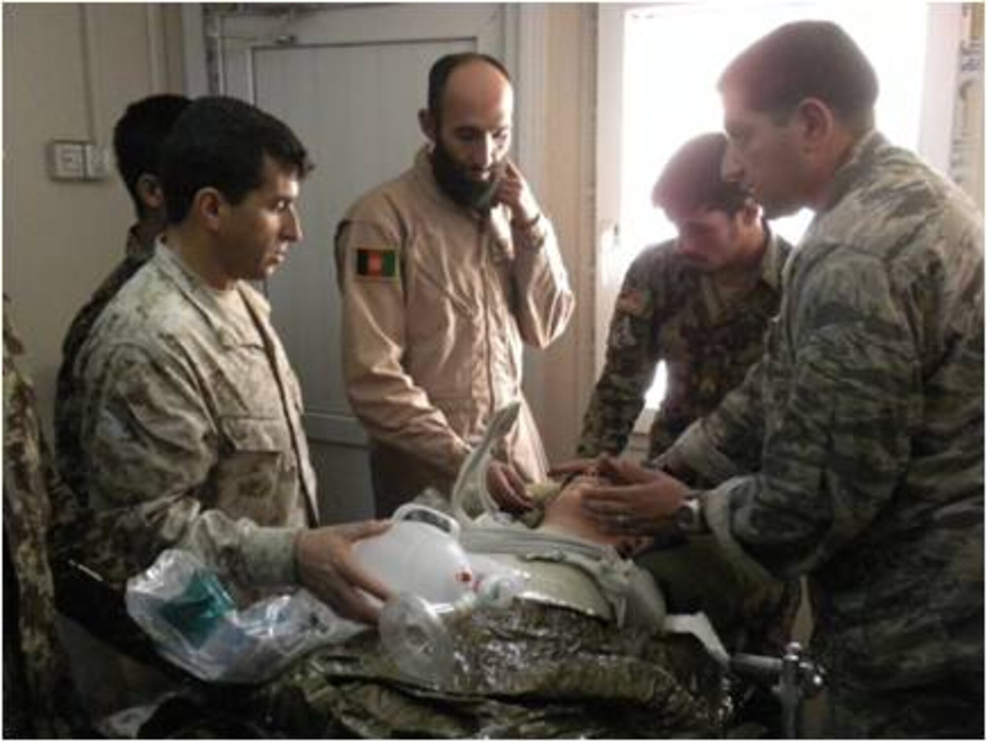 Advisers from the 738th Air Expeditionary Advisory Group, teach basic airway management procedures during the basic flight medic course recently. The goal of the 40-hour course was to combine ground and flight medical training to produce a better-rounded medical Afghan Air Force professional. (U.S. Air Force courtesy photo)