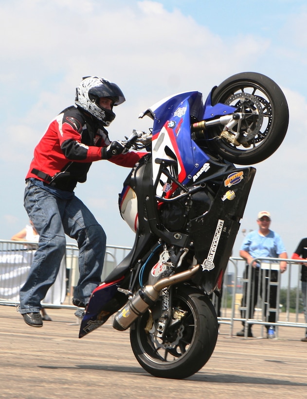 Chris “Teach” McNeil, professional freestyle rider, shows off his arsenal of tricks for the crowd during a trick demonstration session at the Semper Ride event here Sept. 17. The session displayed what expert riders, like McNeil, can learn in years of riding in safe and controlled environments.::r::::n::::r::::n::::r::::n::