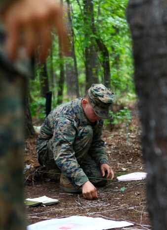 Lance Cpl. Matthew Hanks, a small arms repair technician with the Headquarters and Service Company, 1st Battalion, 2nd Marine Regiment creates a terrain model on Fort Pickett, Va., Sept. 17. More than 900 Marines and sailors are taking part in the Deployment for Training exercise at Fort Pickett, Sept. 6-23. The battalion is scheduled to attach to the 24th Marine Expeditionary Unit as its Battalion Landing Team a few days after the training.