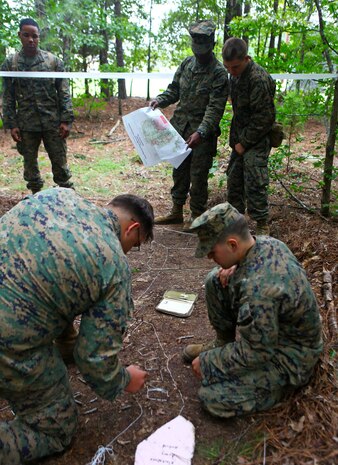 Marines with the Headquarters and Service Company, 1st Battalion, 2nd Marine Regiment create a terrain model on Fort Pickett, Va., Sept. 17. More than 900 Marines and sailors are taking part in the Deployment for Training exercise at Fort Pickett, Sept. 6-23. The battalion is scheduled to attach to the 24th Marine Expeditionary Unit as its Battalion Landing Team a few days after the training.