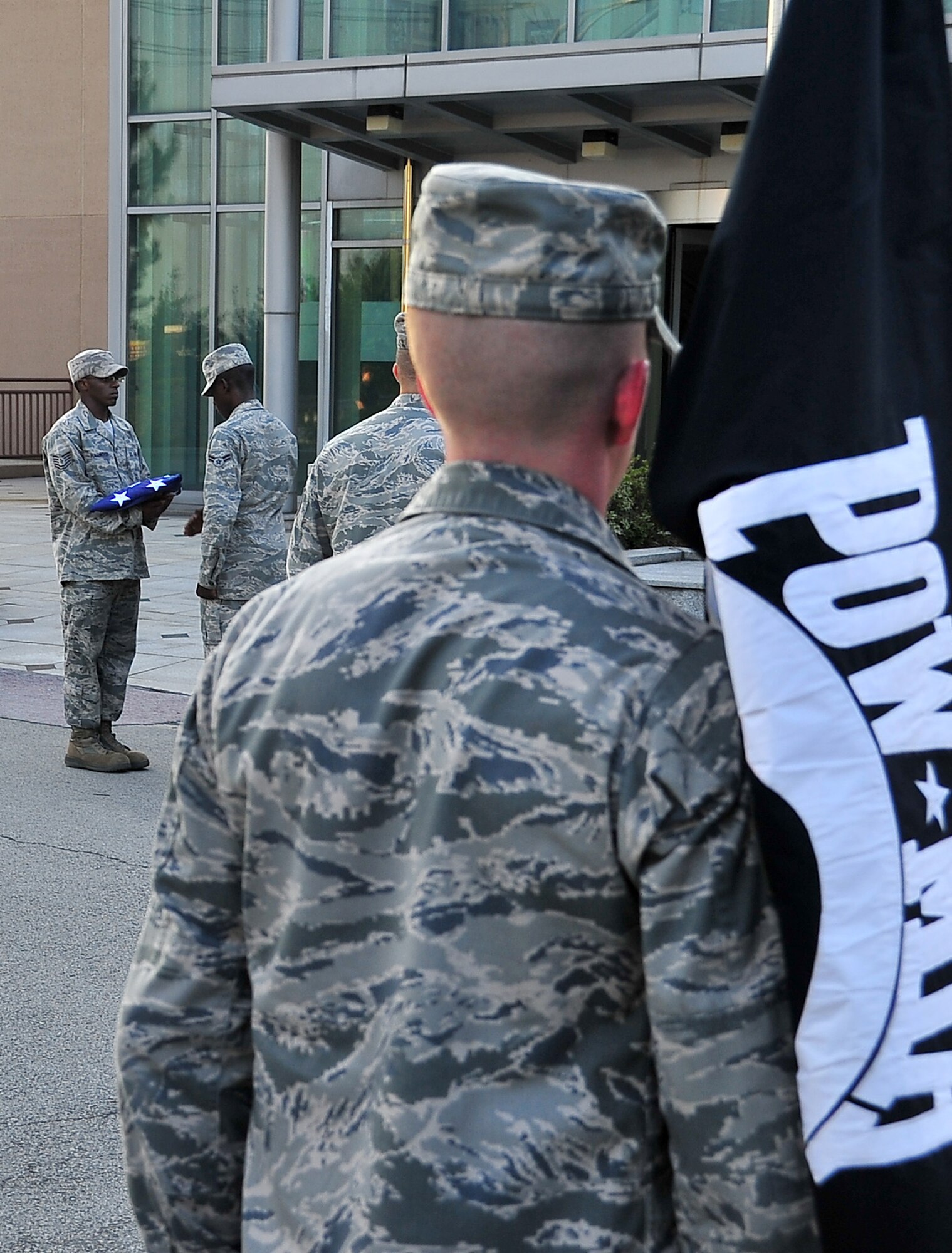 Airmen with the base honor guard fold an American flag during a POW/MIA retreat ceremony Sept. 15 at the base flagpole. The retreat ceremony signified the beginning of a 24-hour run where the POW/MIA flag was carried non-stop by runners around a 1.2-mile course. Members of the Osan’s Air Force Sergeants Association honored all POW/MIAs during several ceremonies and events Sept. 12-16. (U.S. Air Force photo/Senior Airman Adam Grant)