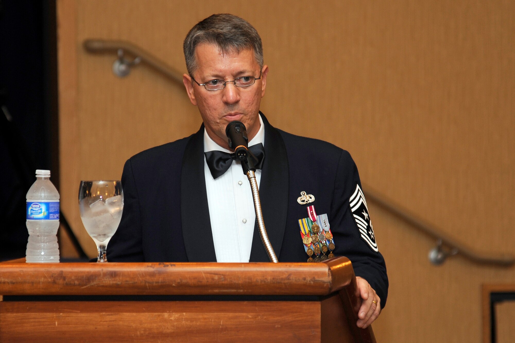 MISAWA AIR BASE, Japan -  Chief Master Sgt. Russell Hastings, 35th Fighter Wing command chief, addresses the members of the 35th Fighter Wing and their guests at the annual Air Force Ball here Sept. 17. During his speech, Chief Hastings talked about where the Air Force has been and where it is going in the future. This year commemorates the 64th anniversary of the U.S. Air Force. (U.S. Air Force photo/Tech. Sgt. Marie Brown)