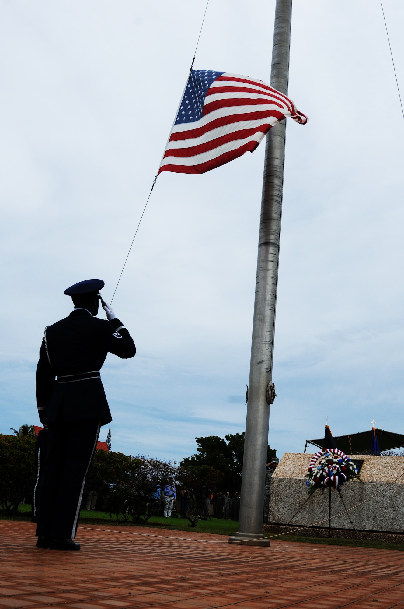 ANDERSEN AIR FORCE BASE, Guam - A 36th Wing Honor Guard member salutes the American Flag during retreat as part of the Prisoner of War and Missing in Action memorial closing ceremony, Sept.16. The ceremony was a base wide event honoring the fallen and the missing from all wars. (U.S. Air Force photo/ Senior Airman Carlin Leslie)